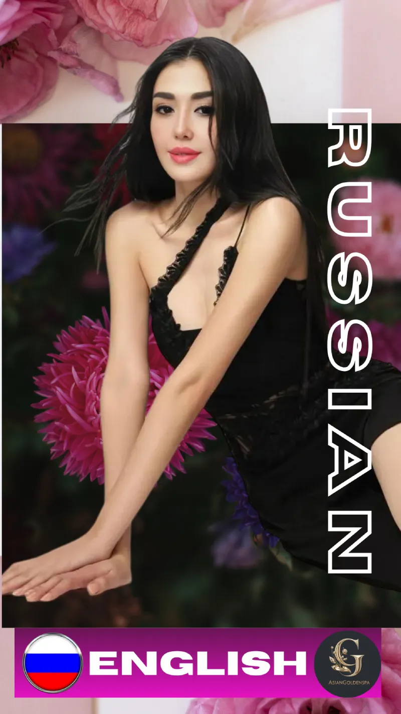 Beautiful Russian woman in a black dress posing elegantly with a floral background, featuring pink and purple flowers. She has long black hair and is looking confidently at the camera. The image includes the words "RUSSIAN" and "ENGLISH" with Russian flag and Asian Golden Spa logo at the bottom. Promotional content for Asian Golden Spa, Ras Al Khaimah, Nakheel Prime Hotel, 1st Floor, Right Side.