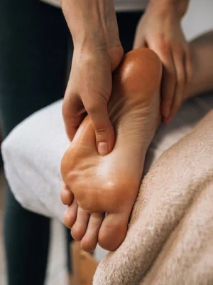 A professional giving a relaxing foot massage at Asian Golden Spa in Ras Al Khaimah