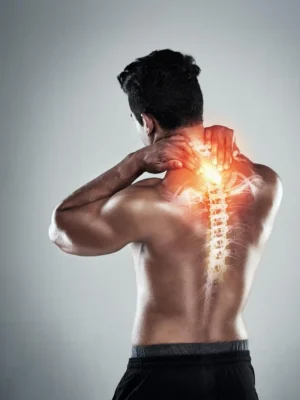 Man with neck and upper spine pain shown with spinal illustration – seeking relief through massage therapy in Ras Al Khaimah at Nakheel, Prime Hotel – Asian Golden Spa – Call 056 978 9770